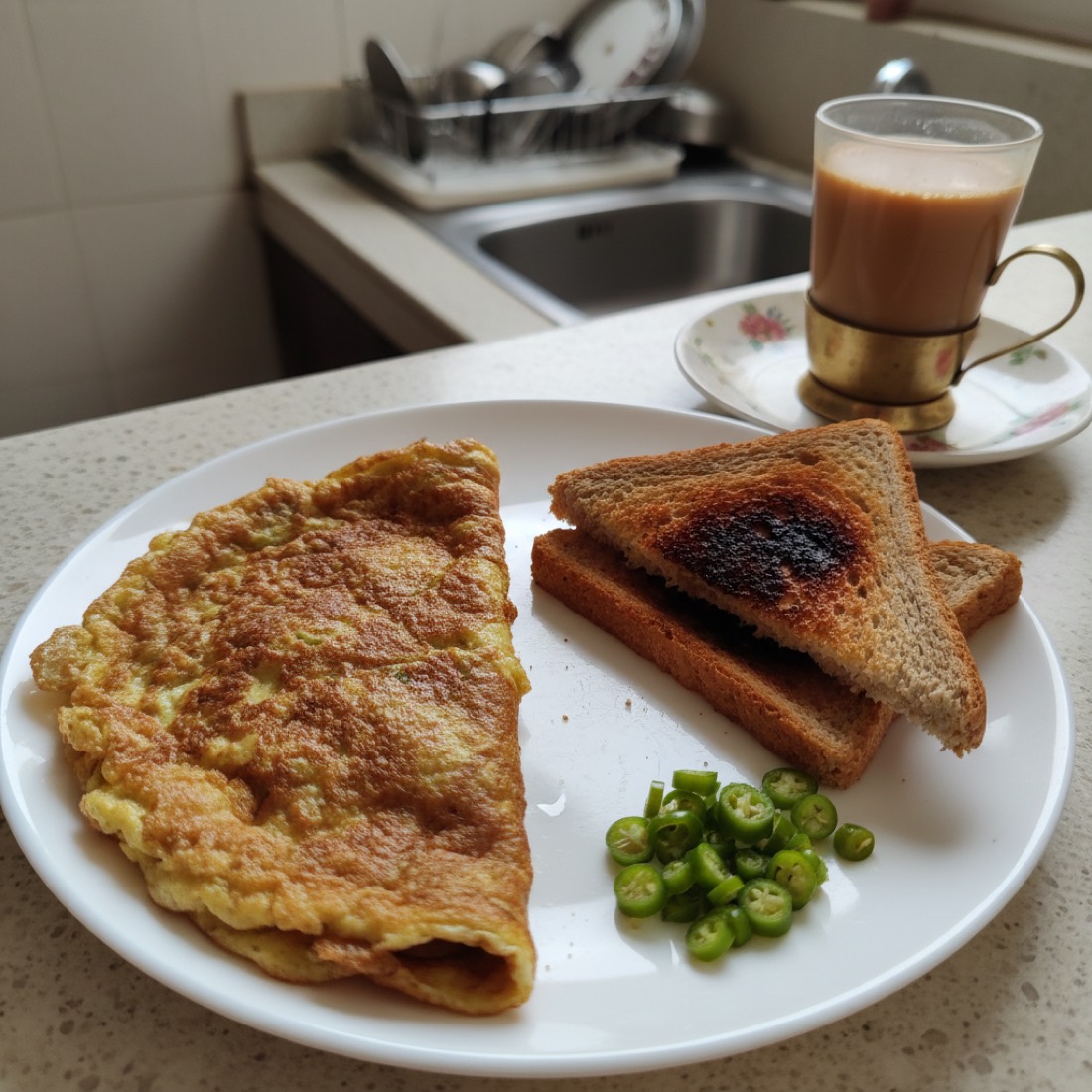 A plate of burnt toast and a lopsided omelette